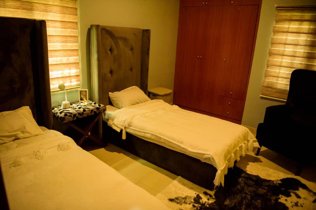 A restful resident room with a brick feature wall