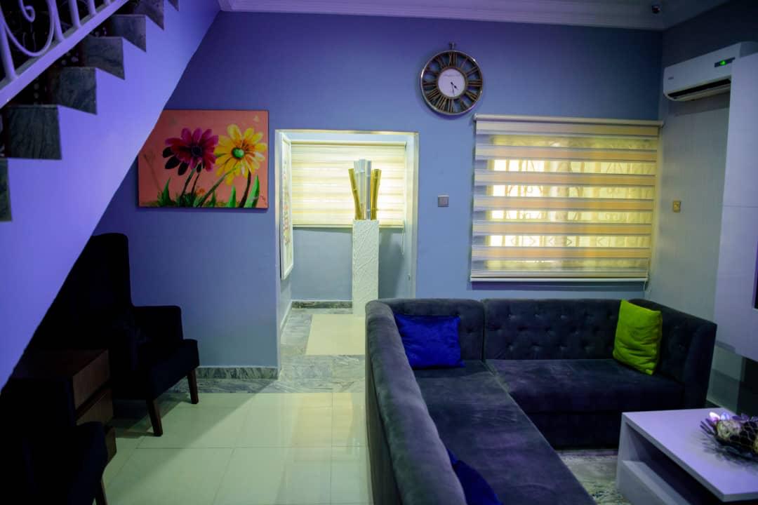 A soft armchair and cushions in a quiet corner of the lounge