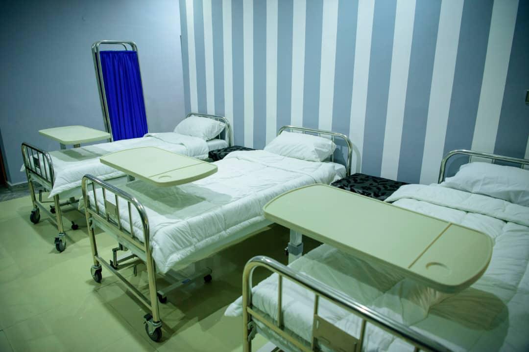 A private resident room with curtains drawn for rest