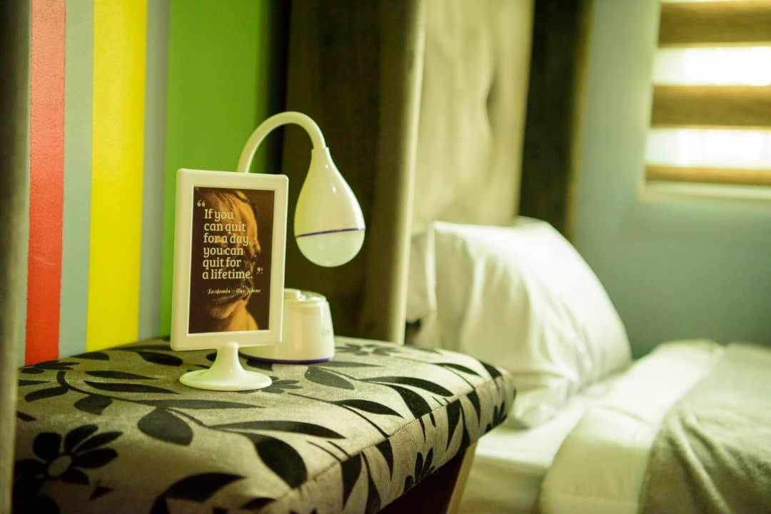 Soft curtains and lamplight in a private room at the facility