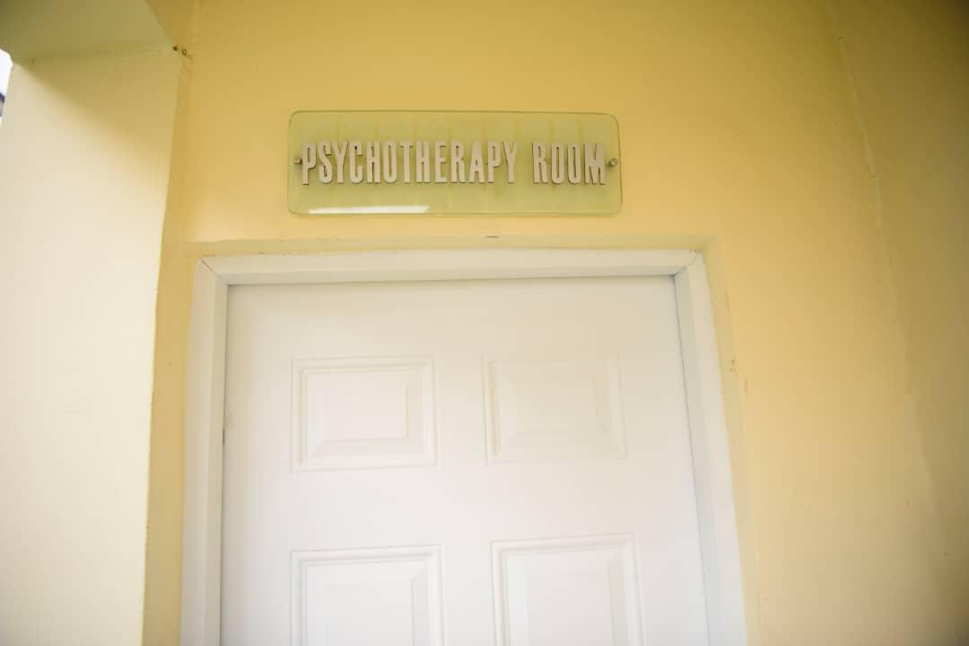 The calm corridor and arrival doors of the outpatient suite
